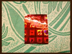 Square piece of shiny red Gift Wrap