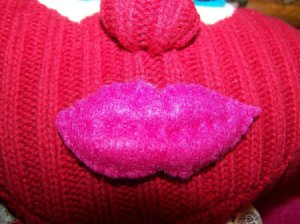Closeup of lips attached to face.