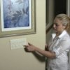 Using Tech for Top Energy Savings, Woman Dimming Lights