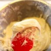 Finished cream cheese frosting in a mixing bowl.