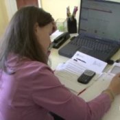 Don't Make Debt Mistakes, Woman Reviewing Her Budget