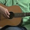Tune an Acoustic Guitar Without a Tuner, Man Tuning Guitar