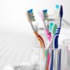 Sanitizing Your Toothbrush, Glass container of toothbrushes.