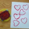 Red inked sponge and stamped paper.