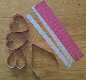 Strips of paper and heart shapes.