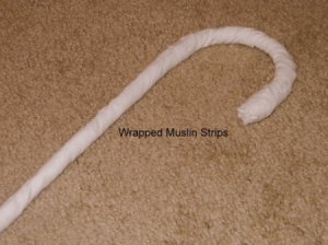 Cane wrapped with muslin strips.