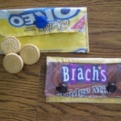 Two small pouches made from candy or cookie wrappers.