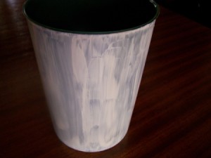 Paint the layer of water-based primer on outside of pot.