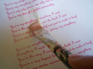 Paint Paper Seal over the printout of the lyrics