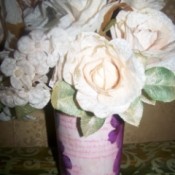 Add some artificial flowers to the vase.