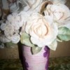 Add some artificial flowers to the vase.