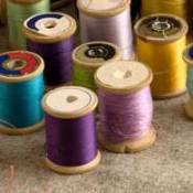 Different colored spools of thread.