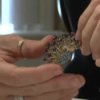How to Recycle, Redesign, and Refashion Jewelry, Woman Holding a Brooch