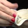 How To Clean Your Jewelry, Woman Polishing a Ring