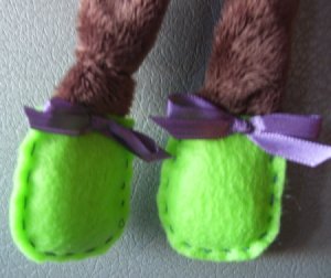 Closeup of green feet.