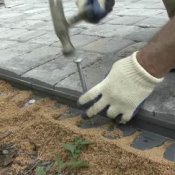How to Install Paving Stones, Man Installing Paving Stones