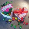 Heart shaped box, frog, and jelly beans.