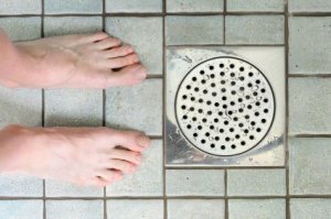 Feet near shower drain