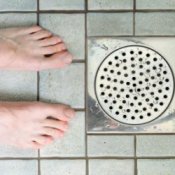 Feet near shower drain