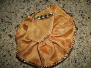 Pin glued to back of finished rose.