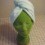 A turban towel on a green mannequin head