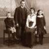 A old black and white photo of a family. 