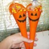 Two funnels full of candy corn for Halloween.