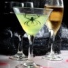 A glowing drink with a spider inside it.