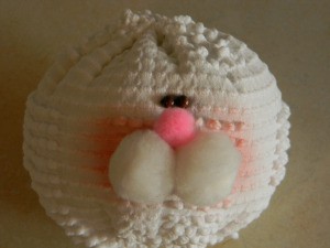 Face after sewing on eyes.
