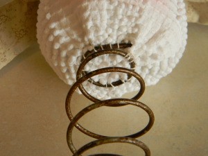 Sewing head to bed spring.