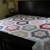 Flower Garden Quilt on bed.