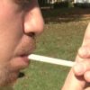 Understanding the High Costs of Smoking, Man Lighting Cigarette
