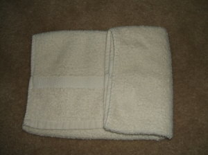 Fold one side in from the center.