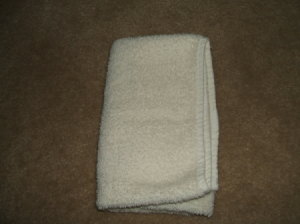 Fold in other side.