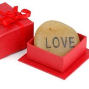 A rock engraved with the word love.