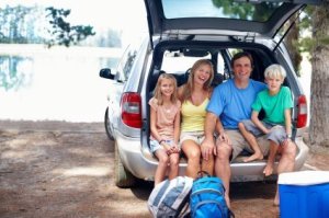 Traveling With Kids, Family on Vacation in the back of Their Car