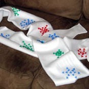Mittens with beaded snowflakes on them.