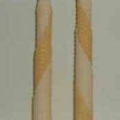 Beeswax candles in a tapered shape.