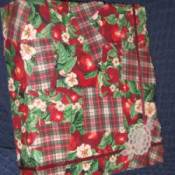 A photo album pieced together with scraps of fabric.