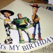 A homemade birthday party hat with Woody, Jessie and Buzz Lighteyear. 