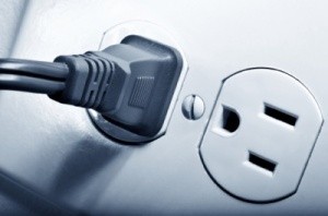 An electric plug in an outlet.