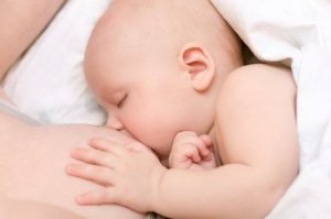 Woman breastfeeding a baby.
