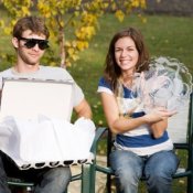 A couple opening wedding gifts.