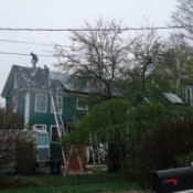 Solar Panels being installed on a house.