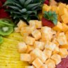 A platter of fruit and cheese.