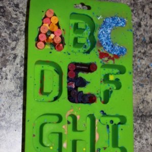 Making recycled letter crayons.