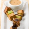 Vegetarian kabob with tofu, mushrooms, and leeks.