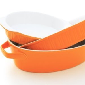 A stack of orange casserole pans.