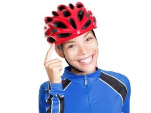 A woman wearing a bike helmet.