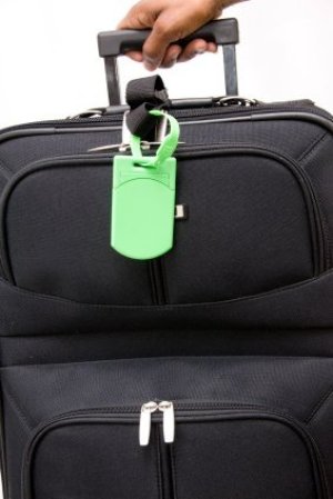 Generic black suitcase with bright green tag.